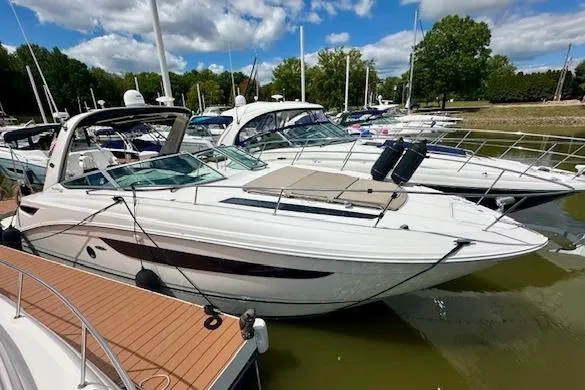  Yacht Photos Pics 2014 Sea Ray 350 Sundancer docked at marina, surrounded by other boats.