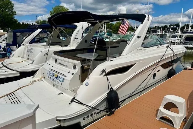  Yacht Photos Pics 2014 Sea Ray 350 Sundancer docked at marina with American flag.