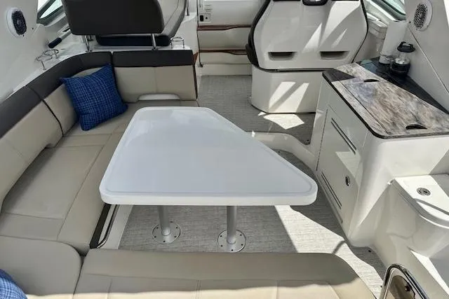  Yacht Photos Pics Interior of 2014 Sea Ray 350 Sundancer with seating and table.