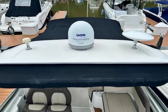  Yacht Photos Pics 2014 Sea Ray 350 Sundancer with TracVision satellite, docked among other boats.