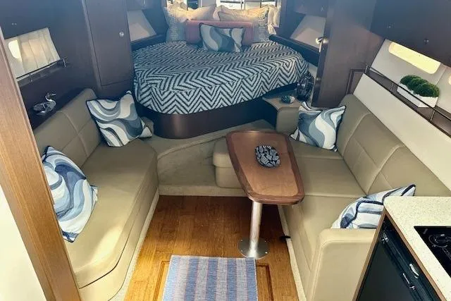  Yacht Photos Pics Interior of 2014 Sea Ray 350 Sundancer with cozy seating and stylish decor.