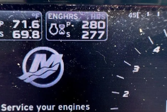  Yacht Photos Pics Close-up of a 2014 Sea Ray 350 Sundancer engine display showing temperature and RPM.