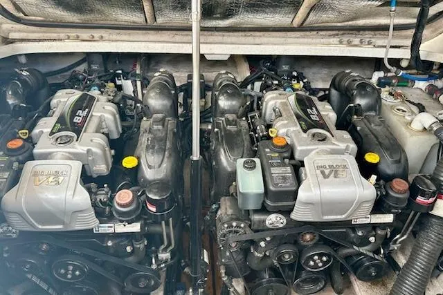  Yacht Photos Pics Twin engines of a 2014 Sea Ray 350 Sundancer boat, showcasing powerful V8 design.