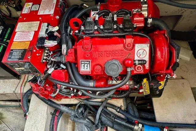  Yacht Photos Pics Engine compartment of a 2014 Sea Ray 350 Sundancer with red Westerbeke EFI engine.