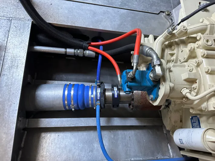 Yacht Photos Pics Engine component of a 2018 Custom 64 Crew Boat with hoses and connectors.