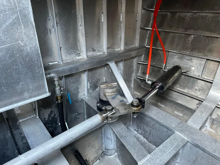  Yacht Photos Pics Interior view of a 2018 Custom 64 Crew Boat showing metal framework and hydraulic components.