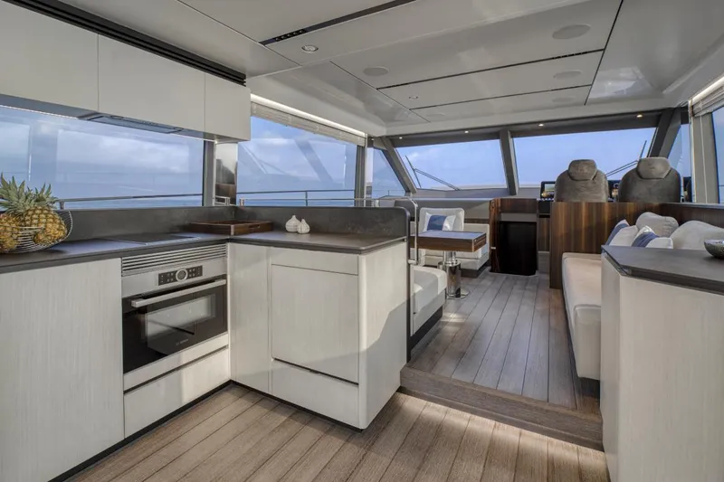 As 5 Yacht Photos Pics Luxurious interior of 2025 Astondoa AS 5 yacht with modern kitchen and seating area.