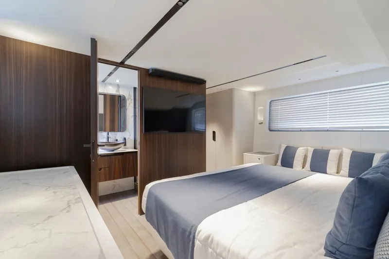 As 5 Yacht Photos Pics Luxurious bedroom interior of 2025 Astondoa AS 5 yacht with modern design and elegant furnishings.