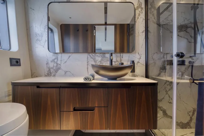 As 5 Yacht Photos Pics Luxurious bathroom in 2025 Astondoa AS 5 yacht with modern sink and marble accents.