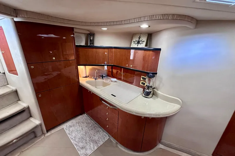  Yacht Photos Pics Luxurious 1999 Sea Ray 460 Sundancer yacht interior with modern kitchenette.