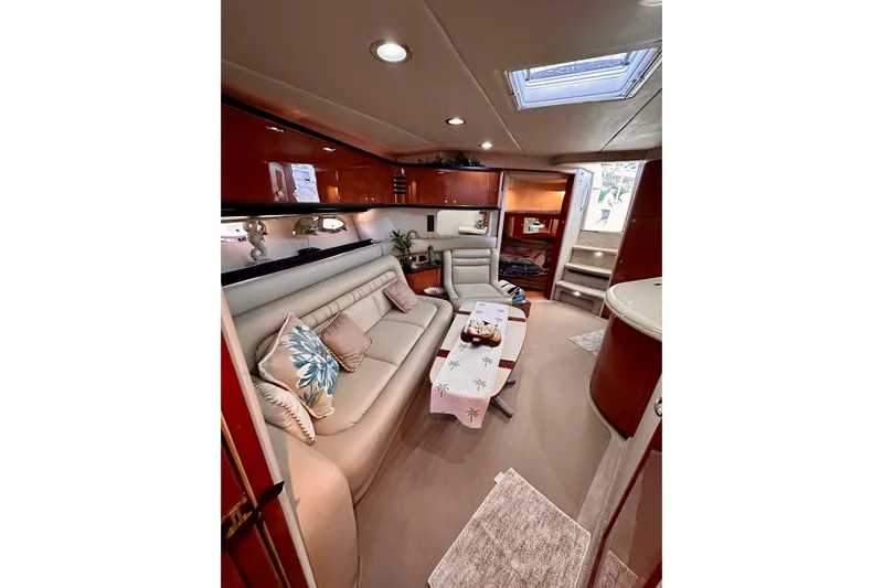 Yacht Photos Pics Luxurious interior of 1999 Sea Ray 460 Sundancer yacht with elegant seating and decor.