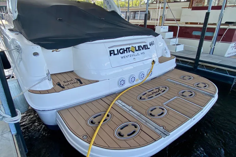  Yacht Photos Pics 1999 Sea Ray 460 Sundancer yacht docked, featuring teak swim platform and covered deck.