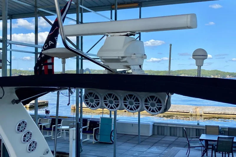  Yacht Photos Pics 1999 Sea Ray 460 Sundancer yacht with radar and speakers, docked under a canopy.