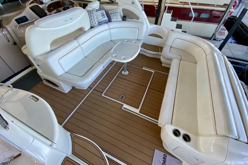  Yacht Photos Pics 1999 Sea Ray 460 Sundancer interior with white seating and wood flooring.