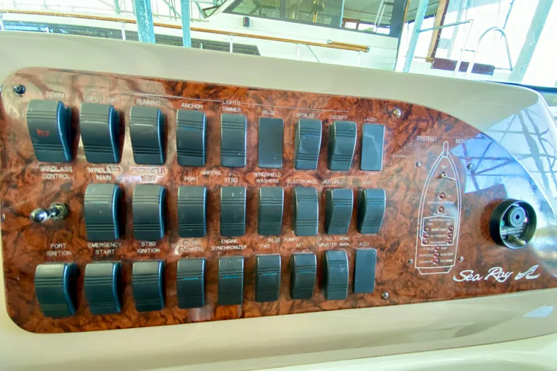  Yacht Photos Pics Control panel of a 1999 Sea Ray 460 Sundancer boat with various switches and labels.