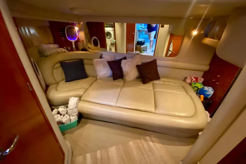  Yacht Photos Pics Luxurious interior of 1999 Sea Ray 460 Sundancer yacht with plush seating and decor.