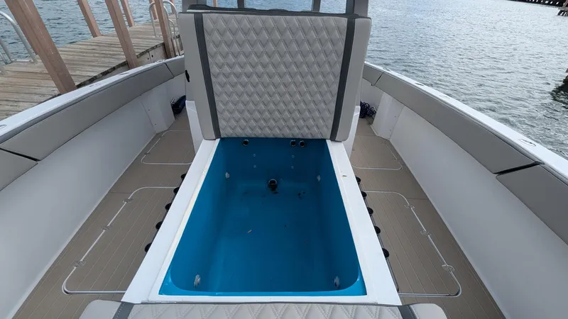  Yacht Photos Pics 2021 Vela 368 Center Console boat interior with seating and storage compartment.