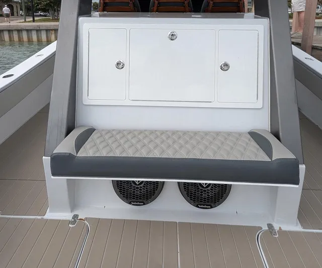 Yacht Photos Pics 2021 Vela 368 Center Console boat interior with cushioned seating and storage compartments.