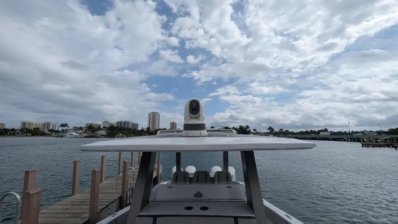  Yacht Photos Pics 2021 Vela 368 Center Console boat docked under cloudy sky.