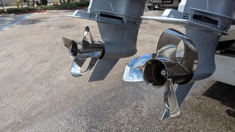  Yacht Photos Pics Twin propellers of a 2021 Vela 368 Center Console boat, shining in sunlight.