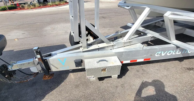  Yacht Photos Pics 2021 Vela 368 Center Console boat trailer hitch and frame on pavement.