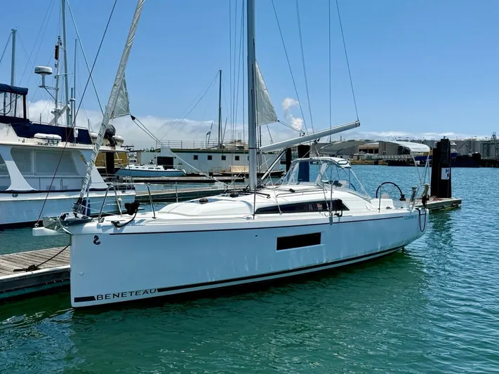 Fasttack Yacht Photos Pics 2024 Beneteau Oceanis 30.1 sailboat docked in a marina under clear blue skies.
