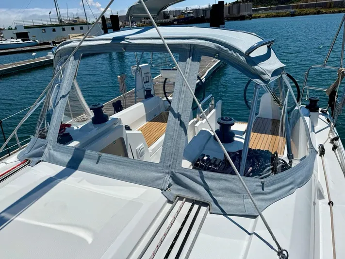 Fasttack Yacht Photos Pics 2024 Beneteau Oceanis 30.1 sailboat with cockpit cover, docked at marina.