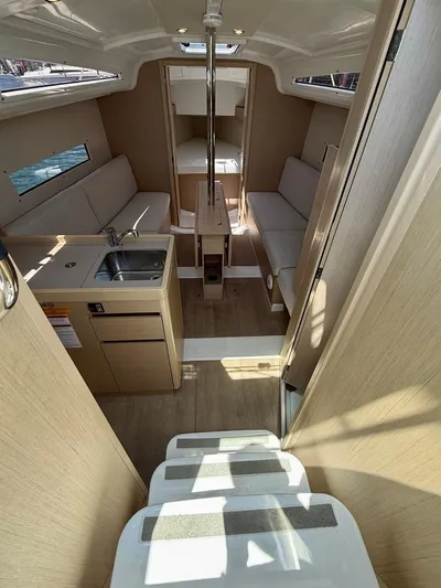 Fasttack Yacht Photos Pics Interior of 2024 Beneteau Oceanis 30.1 sailboat, featuring modern design and cozy seating.