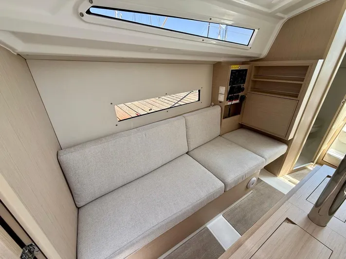 Fasttack Yacht Photos Pics 2024 Beneteau Oceanis 30.1 interior with beige sofa and modern design.