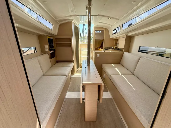 Fasttack Yacht Photos Pics Interior of 2024 Beneteau Oceanis 30.1 sailboat, featuring modern seating and natural light.