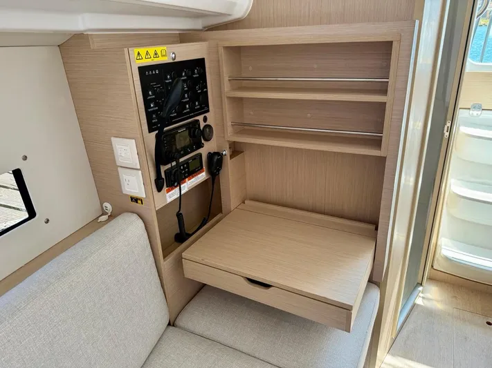 Fasttack Yacht Photos Pics 2024 Beneteau Oceanis 30.1 interior with control panel and seating area.