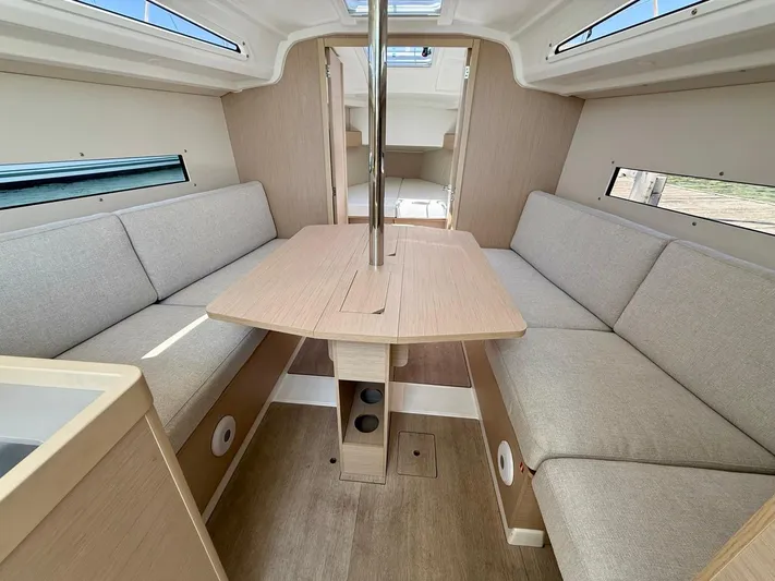 Fasttack Yacht Photos Pics 2024 Beneteau Oceanis 30.1 interior with cozy seating and modern design.