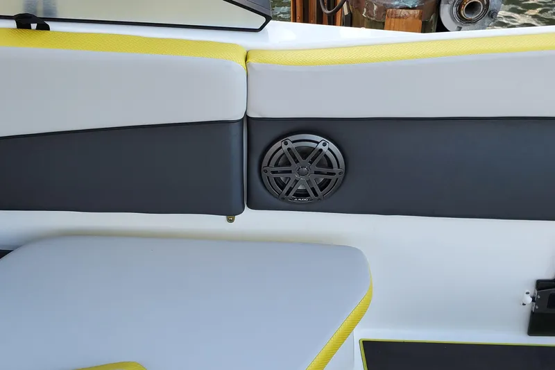  Yacht Photos Pics 2024 Scarab 285 Wake ID boat interior with speaker and yellow-accented seating.