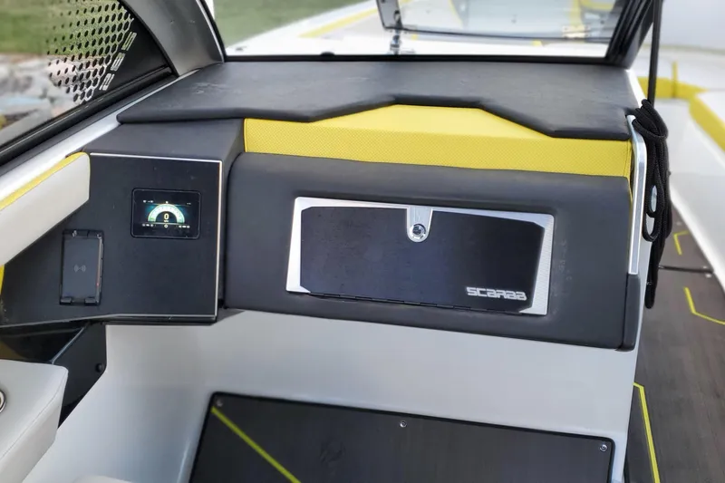  Yacht Photos Pics 2024 Scarab 285 Wake ID boat dashboard with digital display and storage compartment.