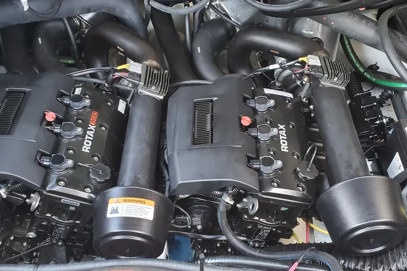  Yacht Photos Pics Twin Rotax engines in 2024 Scarab 285 Wake ID boat, showcasing powerful marine performance.