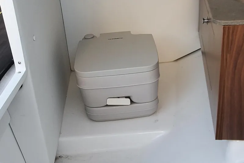  Yacht Photos Pics Portable toilet inside 2024 Scarab 285 Wake ID boat cabin.