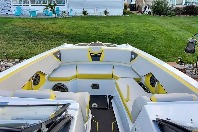  Yacht Photos Pics 2024 Scarab 285 Wake ID boat interior with yellow and gray seating, outdoor setting.