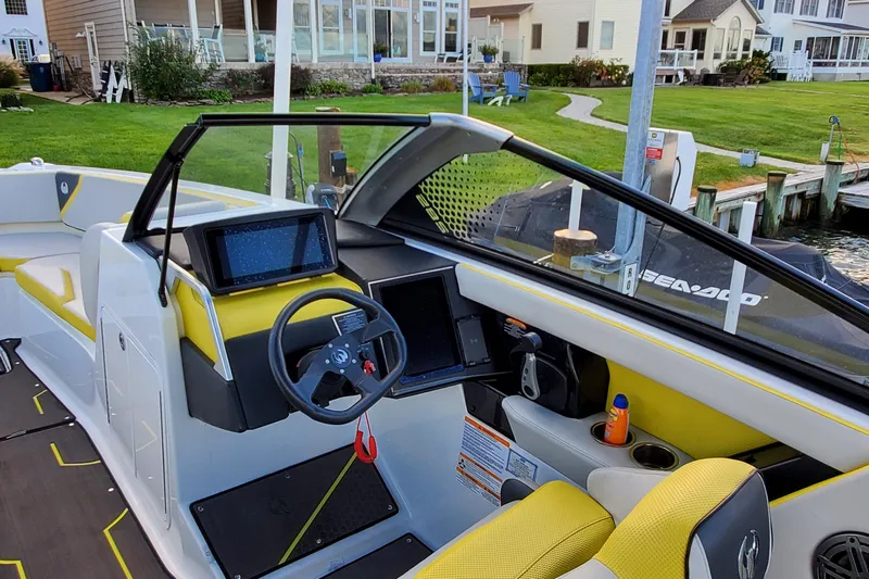  Yacht Photos Pics 2024 Scarab 285 Wake ID boat interior with modern dashboard and steering wheel.