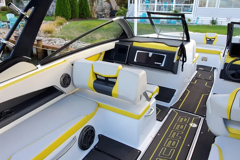  Yacht Photos Pics 2024 Scarab 285 Wake ID boat interior with yellow accents and modern seating.