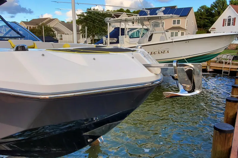  Yacht Photos Pics 2024 Scarab 285 Wake ID boat docked, featuring sleek design and modern amenities.