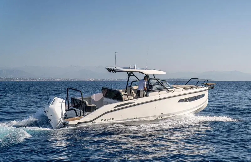  Yacht Photos Pics Navan S30 2025 boat cruising on open water under clear blue sky.