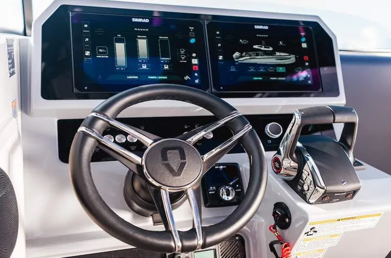  Yacht Photos Pics Steering wheel and control panel of 2025 Navan S30 boat with digital displays.