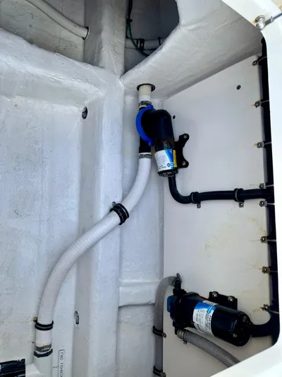 Lulu Yacht Photos Pics 2020 Invincible 35 Catamaran bilge area with pumps and hoses.