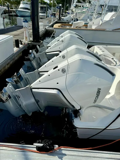 Lulu Yacht Photos Pics 2020 Invincible 35 Catamaran with multiple Mercury outboard engines docked at marina.