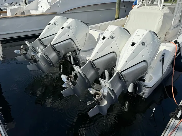 Lulu Yacht Photos Pics 2020 Invincible 35 Catamaran with four powerful outboard engines docked in marina.