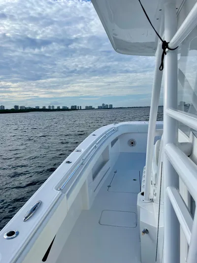 Lulu Yacht Photos Pics 2020 Invincible 35 Catamaran on open water under cloudy sky.