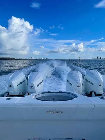 Lulu Yacht Photos Pics 2020 Invincible 35 Catamaran cruising with powerful Mercury engines on open water.