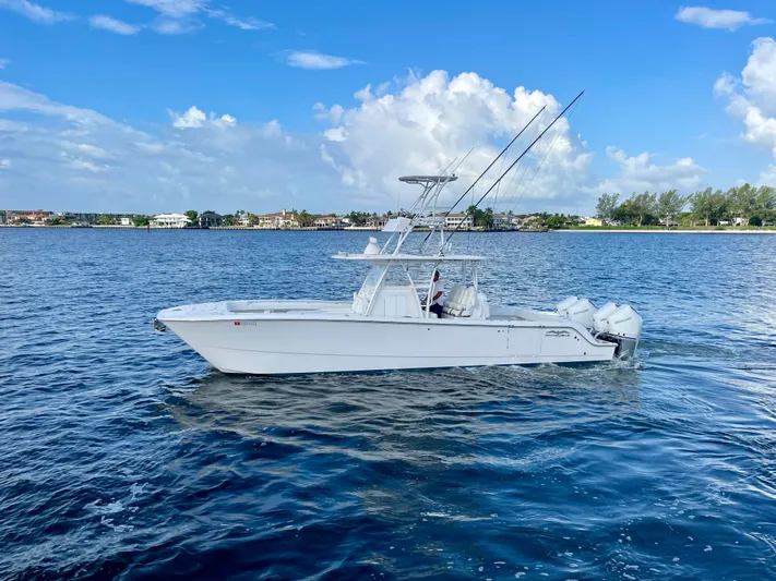 Lulu Yacht Photos Pics 2020 Invincible 35 Catamaran on calm blue water under a clear sky.