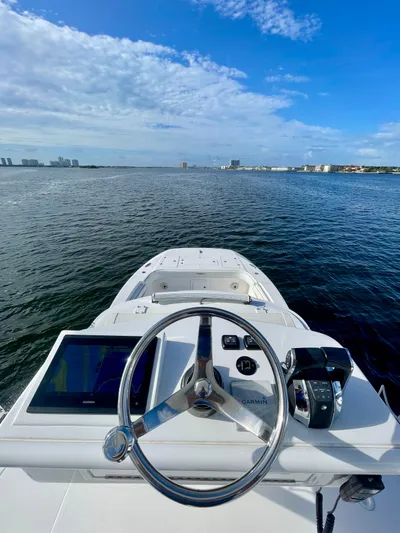 Lulu Yacht Photos Pics 2020 Invincible 35 Catamaran steering console with ocean view and clear blue sky.