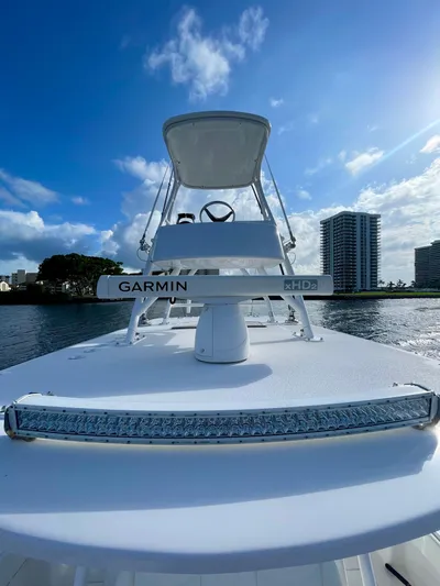 Lulu Yacht Photos Pics 2020 Invincible 35 Catamaran on water, featuring Garmin electronics, under a clear blue sky.